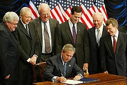 George W. Bush signing the Partial-Birth Abortion Ban Act of 2003, surrounded by members of Congress PBAsigning.jpg