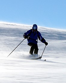 A man alpine skiing