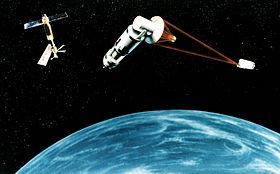 The 1984 Strategic Defense Initiative concept of a generic space based Nuclear reactor pumped laser or a hydrogen fluoride laser satellite, firing on a target, causing a momentum change in the target object by laser ablation. With the proposed Space Station Freedom (ISS) in the background. Space Laser Satellite Defense System Concept.jpg