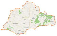 Mapa konturowa gminy Wierzbinek, blisko lewej krawiędzi nieco na dole znajduje się owalna plamka nieco zaostrzona i wystająca na lewo w swoim dolnym rogu z opisem „Jezioro Czarne”