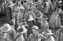 Soldiers disembarking from a ship