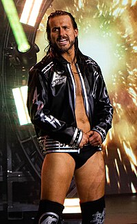 Cole appearing in AEW in 2022 Adam Cole, June 2022 (cropped).jpg