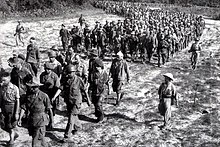 Captured French soldiers from Dien Bien Phu, escorted by Vietnamese troops, 1954 Dien Bien Phu 1954 French prisoners.jpg