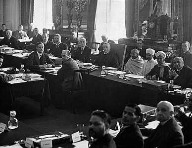 British prime minister, Ramsay MacDonald, three places to the right of Gandhi (to the viewer's left) at the 2nd Round Table Conference. Samuel Hoare is two places to Gandhi's right. Foreground, fourth from left, is B. R. Ambedkar representing the "Depressed Classes"