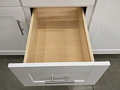 framed base cabinet with open drawer