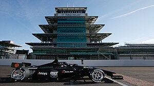 The Dallara IL-15 in front of the IMS Pagode