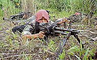 Moro Islamic Liberation Front fighter in the Philippines MILF militant lying prone.jpg