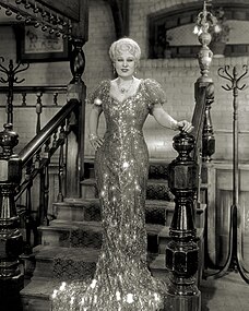 Mae West in the 1933 film She Done Him Wrong, wearing a nightgown designed by Edith Head.