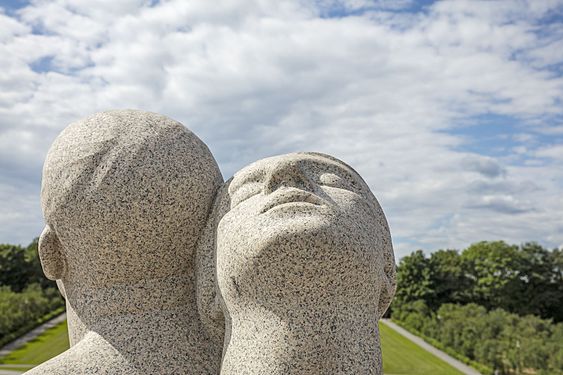 Young man and woman sitting back to back, detail (1919)