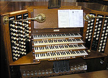 The console of a pipe organ (musical instrument).