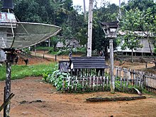 Sandung of Dayak Pebihingan people, side by side with two tombs. Ketapang Regency Sandung 101101-8268 lap.JPG