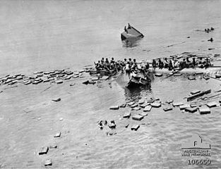Survivors from the Jacob cling to wreckage before they are rescued