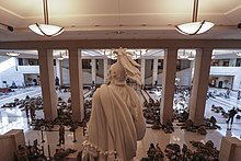 Troops resting on the floor of Emancipation Hall inside the Capitol 210113-Z-NI803-1008 (50884641238).jpg