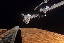 Astronaut Scott Parazynski of STS-120 conducted a 7-hour, 19-minute spacewalk to repair (essentially sew) a damaged solar panel which helps supply power to the International Space Station. NASA considered the spacewalk dangerous with potential risk of electrical shock. Astronaut Scott Parazynski repairs a damaged ISS solar panel.jpg