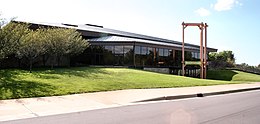 Front of the museum's welcome center, a modern, landscaped building