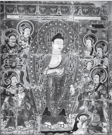 A Buddha, surrounded by several figures, including one (Sumedha) prostrating in front of the Buddha’s feet