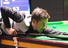 David Gilbert playing a shot