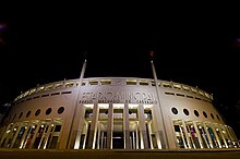 Night view of the facade of a Stadium.