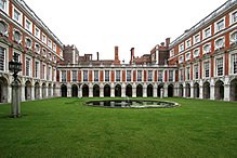 The Fountain Court designed by Sir Christopher Wren (E on plan): "Startling, as of simultaneous exposure to a great many eyes with raised eyebrows" Hampton-Court-E.jpg