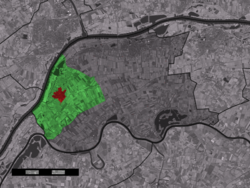 The town centre (red) and the statistical district (light green) of Dreumel in the municipality of West Maas en Waal.