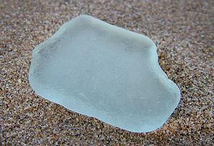 Rounded glass on beach.