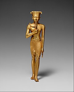 Древнеегипетская статуэтка Амона; 945—715 годы до н. э.; золото; 17,5 × 4,7 см; Метрополитен-музей (Нью-Йорк)