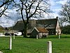 Boerderij met zijbaander en bakstenen gevel aan woongedeelte