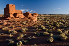 Stone pueblo on shrubland