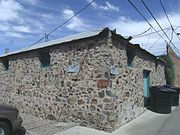 The Stone Warehouse was built in 1922 and is located in the rear of the building at 119 Florence St. It was listed in the National Register of Historic Places in 1985, reference #85000896.