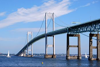 Claiborne Pell Newport Bridge is a suspension bridge operated by the Rhode Island Turnpike and Bridge Authority that spans the East Passage of the Narragansett Bay, connecting the City of Newport on Aquidneck Island and the Town of Jamestown on Conanicut Island. The bridge is four lanes (two in each direction) and is part of RI 138.