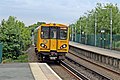 A Merseyrail Class 507 departs towards Liverpool.