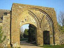 Stone building with two large arched windows