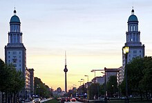 The Berlin TV tower, far in the distance, sits exactly between the twin towers on the western side of the square.