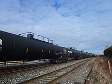 Tank cars in a Canadian train for carrying liquid petroleum gas by rail LPG tank cars passing through Bolton ON.jpg