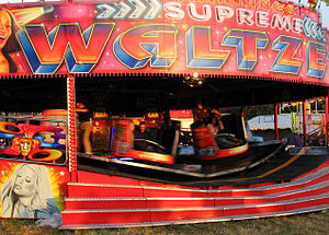A waltzer in motion. The operator walks the bo...