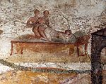 Sex between a female and two males. Wall painting. Suburban baths, Pompeii. 62 to 79 CE Terme di porta marina, affreschi a tema erotico nello spogliatoio, 05.jpg