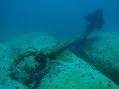 The anchor on the reef beyond the caves