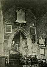 Side chapel, showing family monuments, c. 1903