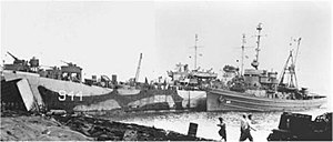 USS Zuni (ATF-95) stranded on Yellow Beach, Iwo Jima with USS LST-944.jpg
