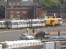 Originally built for passenger service, this railcar was later converted to a clearance car with "feelers". WMATA Rohr 1028 with locomotive.jpg