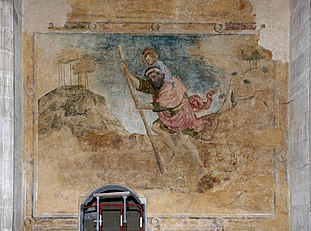 "Good-natured giant Saint Christopher carrying the child Jesus." Abbey church of Saint-Antoine l'Abbaye, France