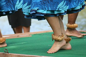 English: Females dancing barefoot
