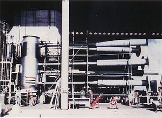 The "Sausage" device casing of the Ivy Mike H bomb, attached to instrumentation and cryogenic equipment. The 20-ft-tall bomb held a cryogenic Dewar flask with room for 160 kg of liquid deuterium. Ivy Mike Sausage device.jpg