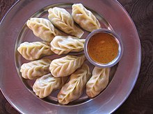 Momo dumplings with chutney Plateful of Momo in Nepal.jpg