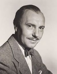 head and shoulders image of middle-aged man, slightly balding, with moustache