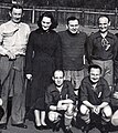 The gentleman to her right is Vlasta Burian, comedian and football referee!