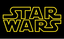 The words Star Wars written in a large, yellow, outline font against a black background