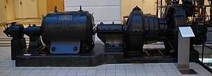 A 250 kW industrial steam turbine from 1910 (right) directly linked to a generator (left) TMW 773 - Steam turbine generator set.jpg