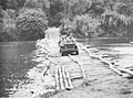 U.S. Army Bantam Jeep crossing a river on the Kapa Kapa Trail during the attack on the Bona Bona Coast by the 32nd Inf Brig in 1942