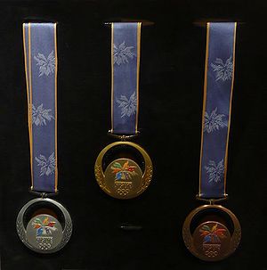 A set of 1998 Winter Olympics medals on displa...